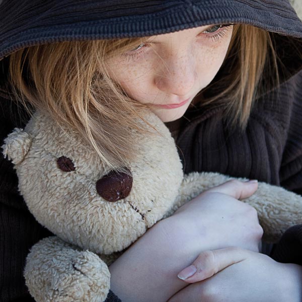 Picture of a young girl holding a teddybear