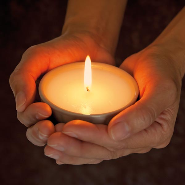 Picture of hands holding a candle